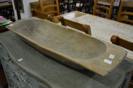 A carved wood pig salting trough.