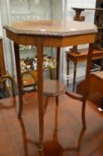 A mahogany octagonal shaped occasional table.