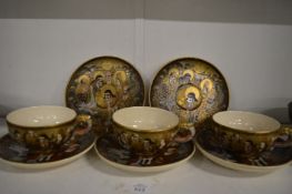 Japanese satsuma cups and saucers.