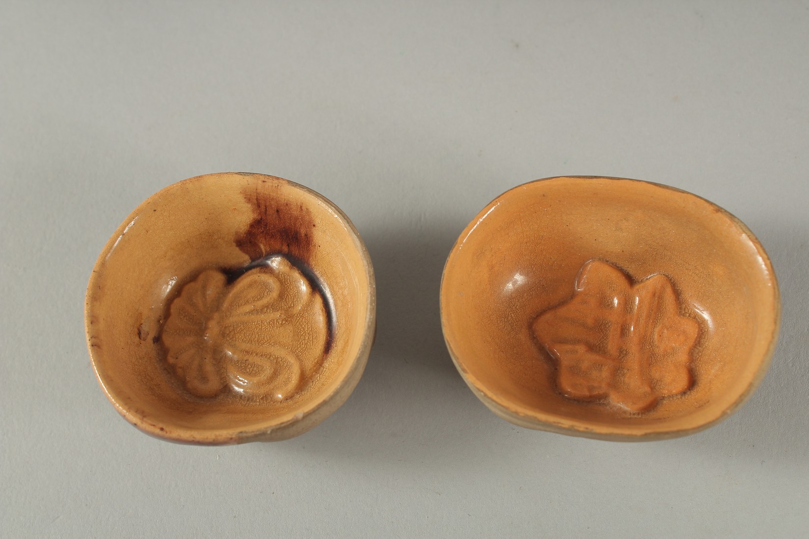 TWO ANTIQUE JAPANESE POTTERY FACE SAKE CUPS, 5cm and 5.5cm wide, (2). - Image 3 of 3