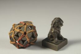 A CHINESE BRONZE SEAL, together with bound coin ornament, (2).