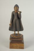 A FINELY FETTLED BRONZE STANDING BUDDHA, fitted to a lotus base plinth, 21cm high.