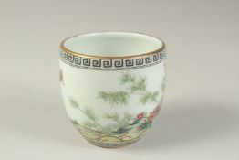 A CHINESE FAMILLE VERTE BIRD AND FLOWER BOWL, 8cm diameter.