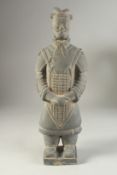 AN ANTIQUE POTTERY TERRACOTTA ARMY WARRIOR REPLICA FIGURE, 44cm high.