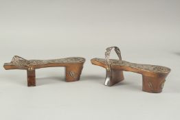 A PAIR OF WHITE METAL FILIGREE MOUNTED TURKISH CLOGS.