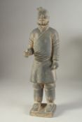 AN ANTIQUE POTTERY TERRACOTTA ARMY WARRIOR REPLICA FIGURE, 44.5cm high.