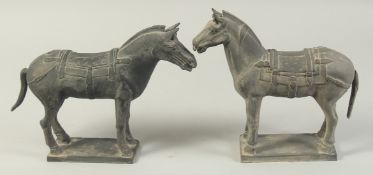 TWO ANTIQUE POTTERY TERRACOTTA WARRIOR HORSE FIGURES, 31cm long.