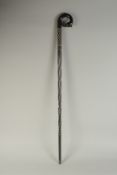 A CEYLONESE BONE INLAID EBONY WALKING STICK, with bird head handle, 91cm long.