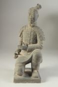 AN ANTIQUE POTTERY TERRACOTTA ARMY WARRIOR REPLICA FIGURE, 34cm high.