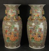 A VERY LARGE PAIR OF CHINESE CANTON FAMILLE ROSE PORCELAIN FLOOR-STANDING VASES, with foo dog a