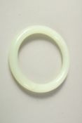 A CHINESE JADE BRACELET, in original fitted box.