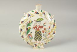 AN OTTOMAN TURKISH KUTAHYA GLAZED POTTERY WATER FLASK, 21cm high.