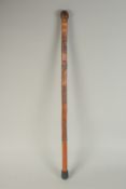 A CHINESE BAMBOO WALKING STICK, carved with monkeys, 75cm long.