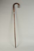 A CHINESE BAMBOO WALKING STICK, with embossed silver mounts, inscribed 'H.E.B', 86cm long.