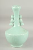 A CHINESE CELADON GLAZED TWIN HANDLE VASE, with lotus root design, character mark to base, 34cm