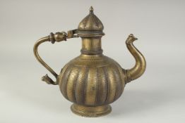 A 19TH CENTURY INDIAN BRASS EWER, with lion head terminals and engraved and ribbed body, 28cm high.