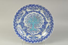 A LARGE TURKISH IZNIK BLUE AND WHITE GLAZED POTTERY PLATE, 41cm diameter.