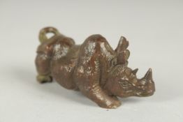 A JAPANESE BRONZE OKIMONO OF A RHINO, 7.5cm long.
