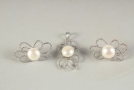 A PAIR OF 14CT WHITE GOLD DIAMOND AND PEARL OPEN WORK EARRINGS with matching pendant.
