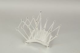 A CHRISTOPHER DRESSER STYLE SILVER PLATED TOAST RACK.