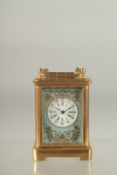 A GOOD MINIATURE BLUE AND GILT FACED BRASS CARRIAGE CLOCK. 2ins high