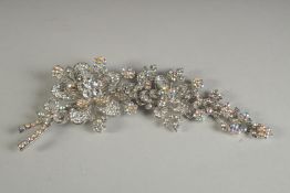 A BUTLER AND WILSON DIAMANTE FLORAL BROOCH.