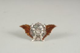 A DECO STYLE SILVER AND ENAMEL DEVIL BROOCH.
