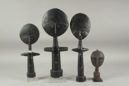 A FAMILY OF FOUR CARVED WOOD AFRICAN FIGURES. 15ins, 13ins, 11ins & 6ins.