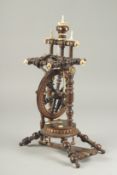 A GOOD WOODEN AND BONE INLAID MINIATURE SPINNING WHEEL. 14ins high.
