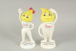 A PAIR OF PAINTED CAST IRON ESSO FIGURES. 9ins high.