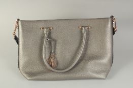 AN AMANDA WAKELEY HAND BAG.