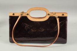 A LOUIS VUITTON BLACK PATENT LEATHER BAG. 12ins long.