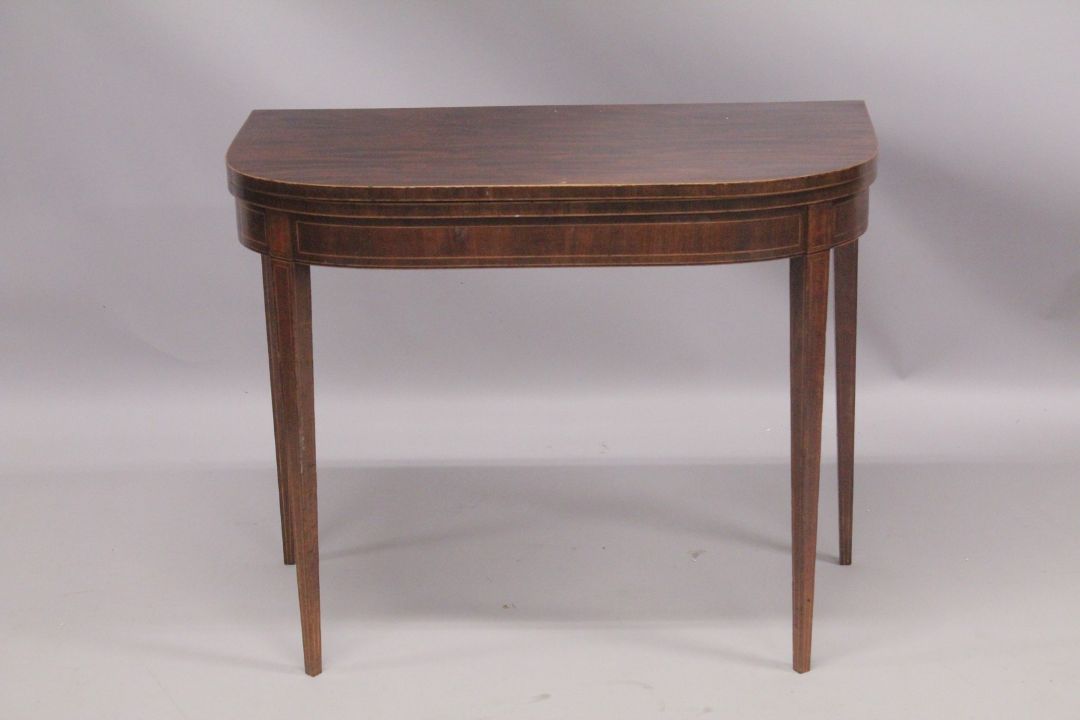 A GEORGIAN MAHOGANY CARD TABLE with folding flap, green baize cover, supported on tapering legs. 3ft - Image 1 of 4