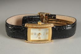 A CAMROSE AND KROSS LADIES WRIST WATCH.