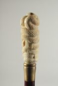 A CARVED BONE HANDLE WALKING STICK 