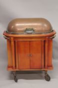 A GOOD HOTEL METAL TROLLEY with rising folding copper cover, fitted interior over a pair of panel
