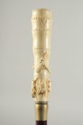 A CARVED BONE HANDLE WALKING STICK 