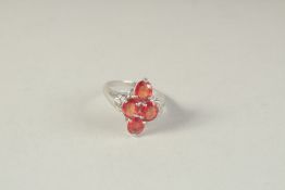 A FOUR STONE RUBY GOLD RING.