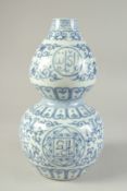 A CHINESE BLUE AND WHITE PORCELAIN DOUBLE GOURD VASE, 32cm high.