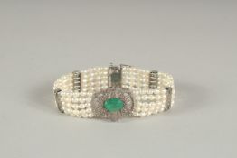 A GOOD DIAMOND, EMERALD AND FIVE ROW PEARL BRACELET.