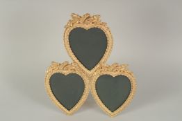 A GILT BRONZE TRIPLE HEART PHOTO FRAME. 13ins high.