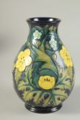 A MOORCROFT BULBOUS FLORAL VASE. W. A. Monogrammed. 7.5ins high.