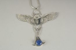 A DECO STYLE SILVER LAPIS BAT PENDANT AND CHAIN.