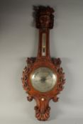 A GOOD 19TH CENTURY WHEEL BAROMETER / THERMOMETER, the well carved wood case with 