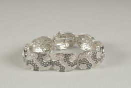 A SILVER CZ BRACELET.