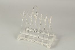 A CHRISTOPHER DRESSER STYLE SILVER PLATED GOLFING TOAST RACK.