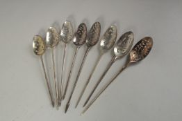 A COLLECTION OF EIGHT VARIOUS SILVER MOTE SPOONS.