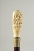 A CARVED BONE HANDLE WALKING STICK 