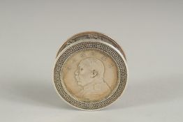 A CHINESE CIRCULAR COIN BOX.