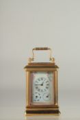 A GOOD MINIATURE PINK PORCLELAIN MULTI DIAL CARRIAGE CLOCK. 3ins high.